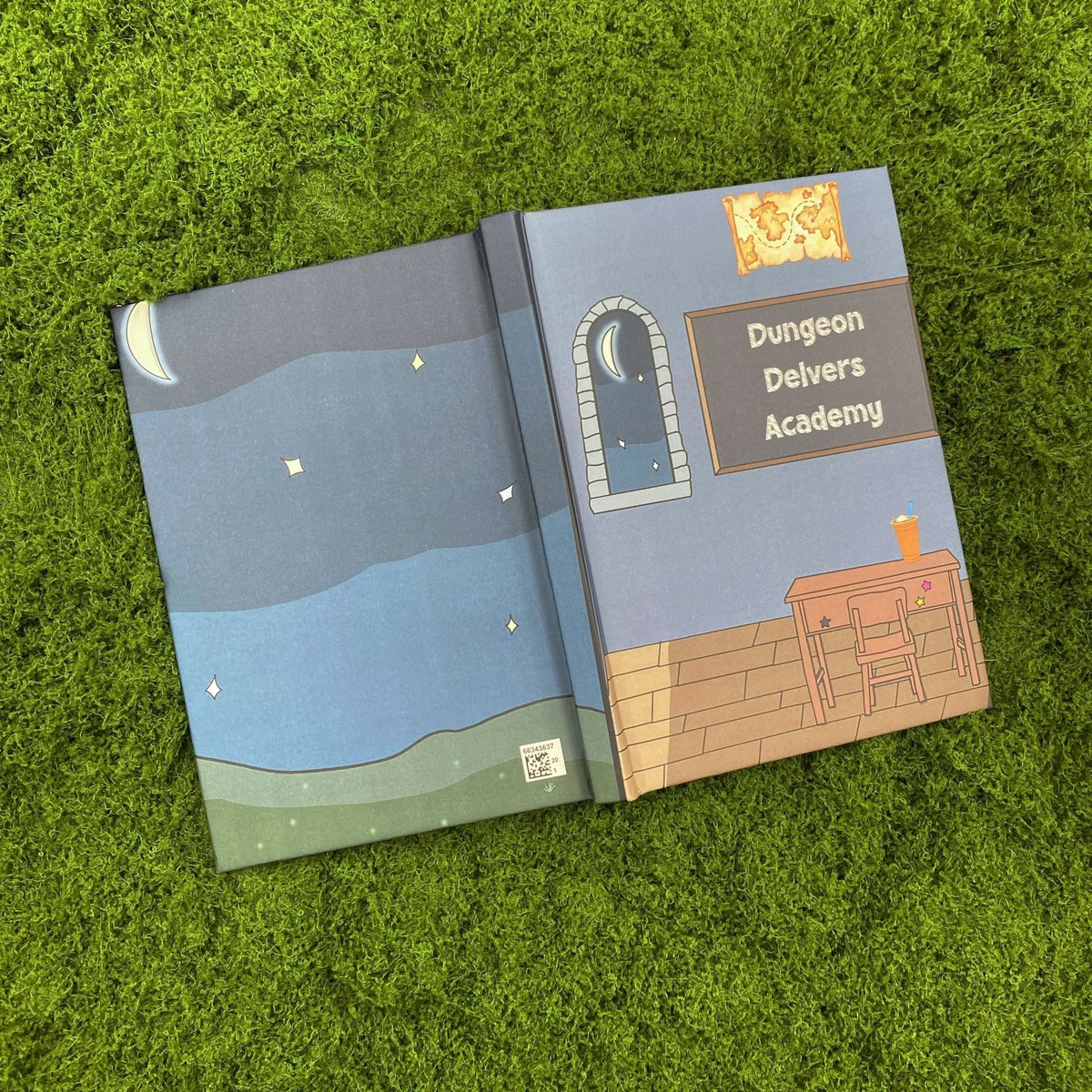 Open hardcover journal showing a plain starry night sky on the back cover and the fantasy classroom 'Dungeon Delvers Academy' design on the front cover
