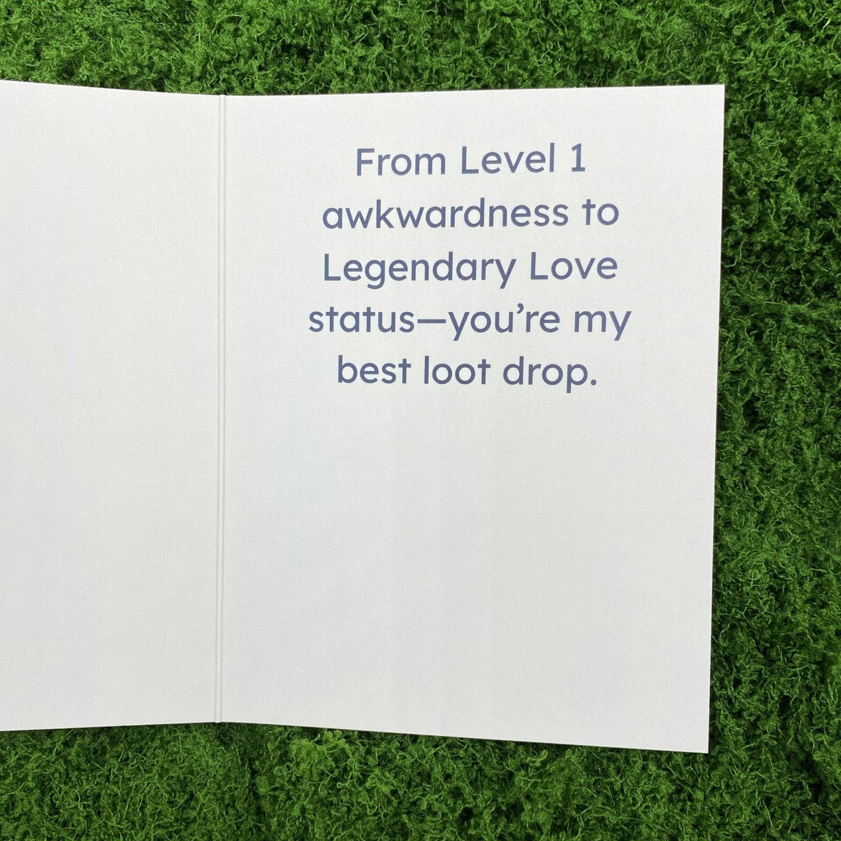 Open interior of the greeting card showing the printed message "From Level 1 awkwardness to Legendary Love status—you're my best loot drop."