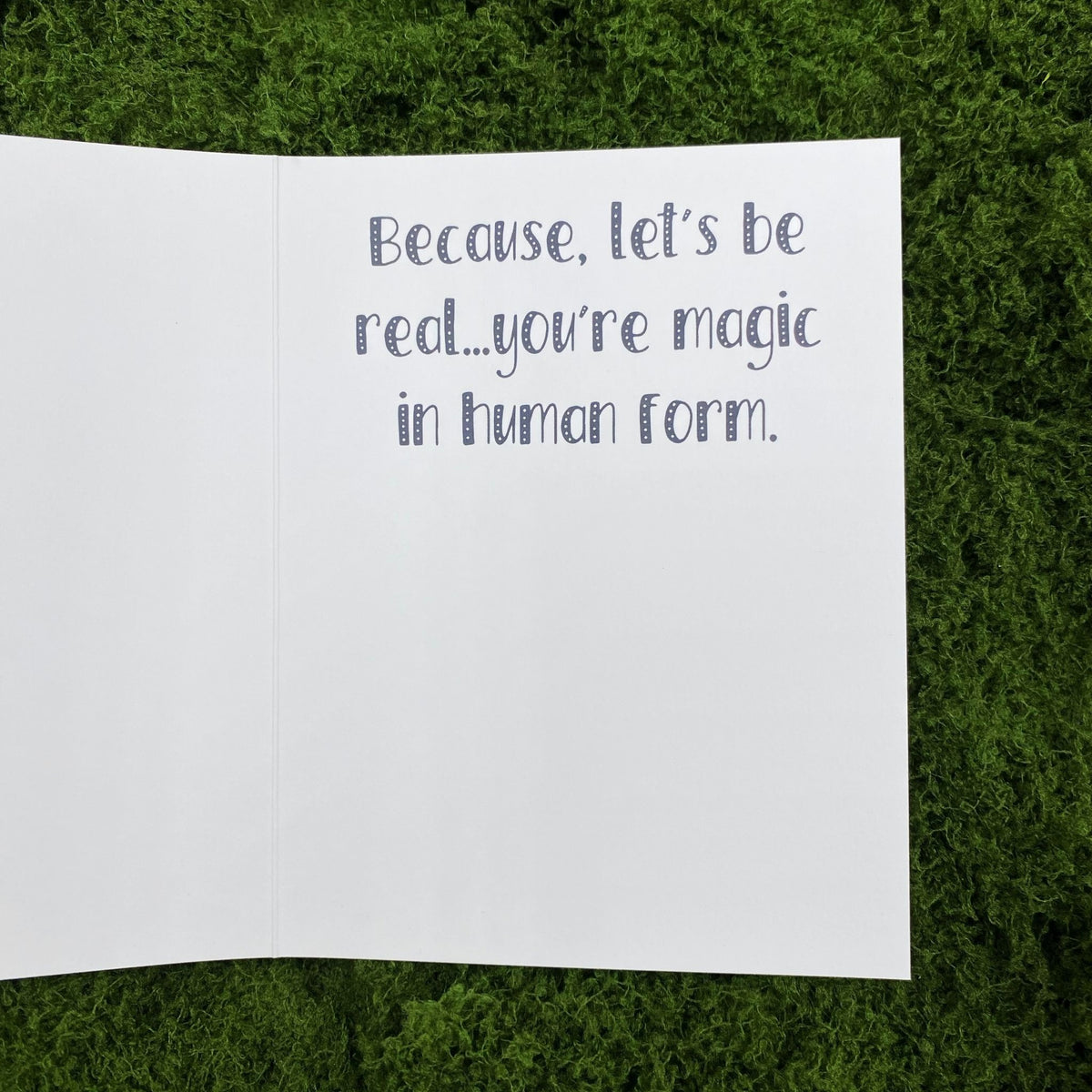 Open interior of the greeting card showing the printed message "Because, let's be real...you're magic in human form."