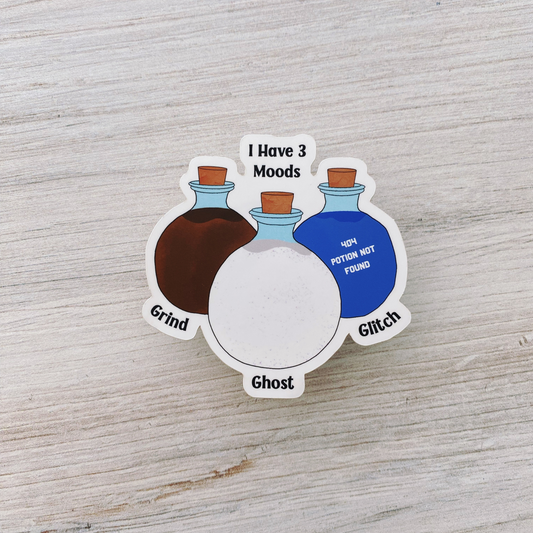 Die-cut vinyl sticker showing three potion bottles labeled Grind, Ghost, and Glitch, with the text "I have 3 moods," on a light wood background